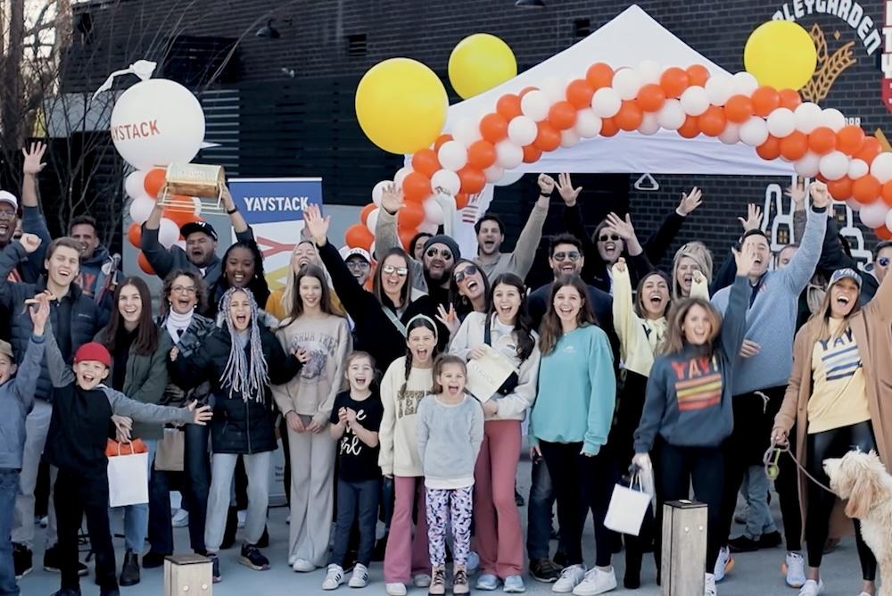 People gathered at a Yaystack community event